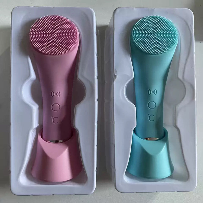 Heated facial cleansing brush