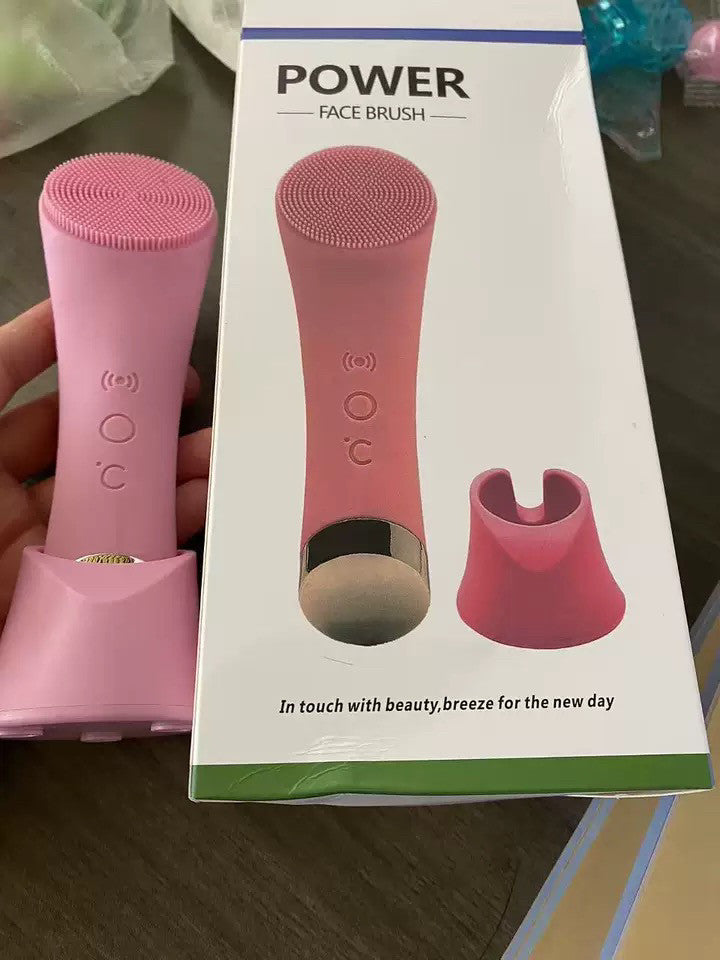 Heated facial cleansing brush